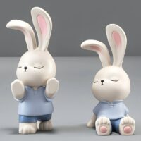 Statue serre livre lapin mignon bleu