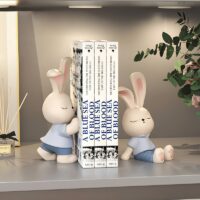 Statue serre livre lapin mignon bleu